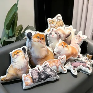 Custom cat shaped pillows displayed on a sofa