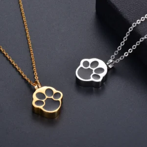 Gold and silver paw print pet memorial pendants close up