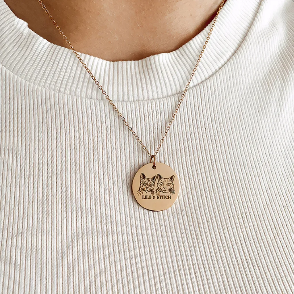 Gold custom pet portrait necklace with two engraved cats