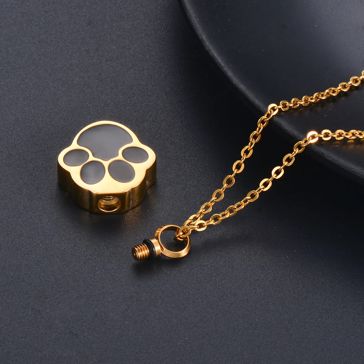 Gold paw print pet memorial pendant with screw opening