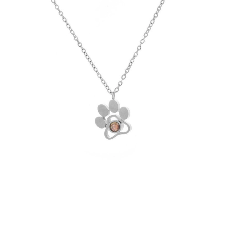 Silver paw photo projection necklace with chain on white background