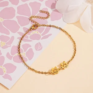 Gold paw print name bracelets with multiple pet charms