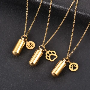 Three gold pet ashes urn necklaces with paw charms